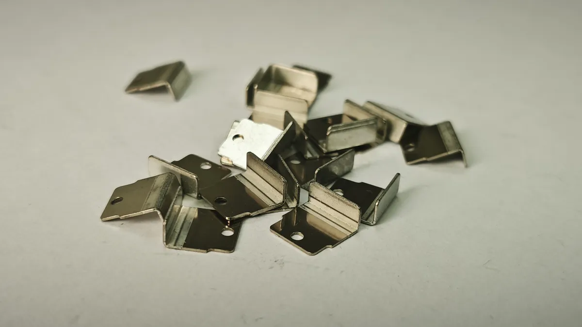 Capacitor terminal, precision stamped